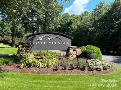 Nestled within the serene embrace of the Cramer Mountain on Cramer Mountain Country Club in North Carolina - for sale on GolfHomes.com, golf home, golf lot