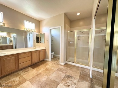 Golf course community, Guard gated. Vault ceiling, travertine on Rhodes Ranch Golf Club in Nevada - for sale on GolfHomes.com, golf home, golf lot