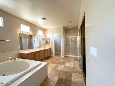 Golf course community, Guard gated. Vault ceiling, travertine on Rhodes Ranch Golf Club in Nevada - for sale on GolfHomes.com, golf home, golf lot