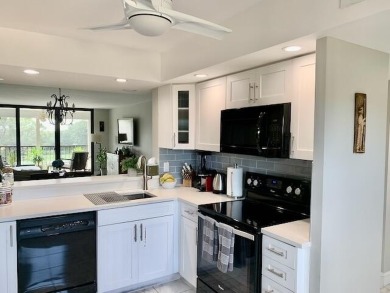 Beautifully renovated home with an amazing lake and golf view in on The Country Club At Boca Raton in Florida - for sale on GolfHomes.com, golf home, golf lot