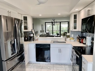 Beautifully renovated home with an amazing lake and golf view in on The Country Club At Boca Raton in Florida - for sale on GolfHomes.com, golf home, golf lot