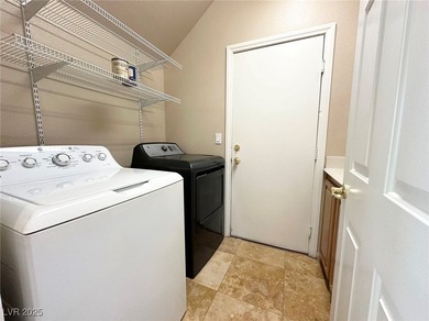 Golf course community, Guard gated. Vault ceiling, travertine on Rhodes Ranch Golf Club in Nevada - for sale on GolfHomes.com, golf home, golf lot