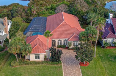 Mediterranean Estate with Marsh Views & Saltwater Pool in a on Marsh Valley Country Club in Florida - for sale on GolfHomes.com, golf home, golf lot