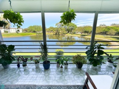 BACK ON THE MARKET WITH NEW KITCHEN WATERFALL COUNTERTOP AND on Wynmoor Golf Course in Florida - for sale on GolfHomes.com, golf home, golf lot