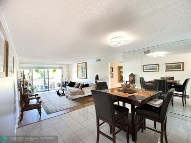 BACK ON THE MARKET WITH NEW KITCHEN WATERFALL COUNTERTOP AND on Wynmoor Golf Course in Florida - for sale on GolfHomes.com, golf home, golf lot