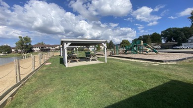 Welcome to resort-style living in the highly sought-after gated on Lakes of the Four Seasons Country Club in Indiana - for sale on GolfHomes.com, golf home, golf lot