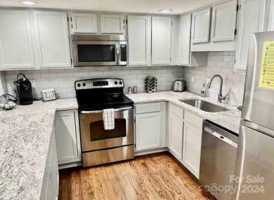 Recently renovated townhome with a bright, modern and open floor on Rumbling Bald Resort on Lake Lure in North Carolina - for sale on GolfHomes.com, golf home, golf lot