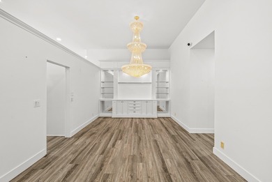 Elegantly and completely remodeled estate home with expansive on PGA National Golf Club in Florida - for sale on GolfHomes.com, golf home, golf lot