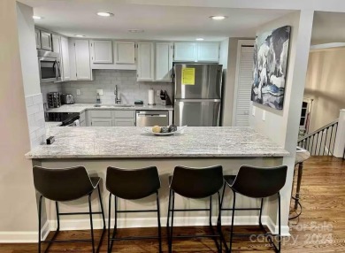 Recently renovated townhome with a bright, modern and open floor on Rumbling Bald Resort on Lake Lure in North Carolina - for sale on GolfHomes.com, golf home, golf lot
