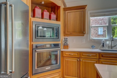 This stunning home offers the perfect blend of elegance, comfort on Indian Creek Golf Club in Georgia - for sale on GolfHomes.com, golf home, golf lot