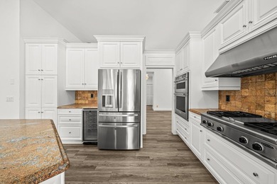 Elegantly and completely remodeled estate home with expansive on PGA National Golf Club in Florida - for sale on GolfHomes.com, golf home, golf lot