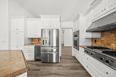 Elegantly and completely remodeled estate home with expansive on PGA National Golf Club in Florida - for sale on GolfHomes.com, golf home, golf lot