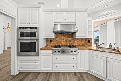 Elegantly and completely remodeled estate home with expansive on PGA National Golf Club in Florida - for sale on GolfHomes.com, golf home, golf lot