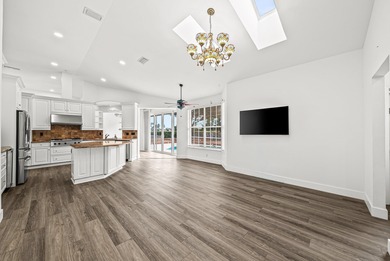 Elegantly and completely remodeled estate home with expansive on PGA National Golf Club in Florida - for sale on GolfHomes.com, golf home, golf lot
