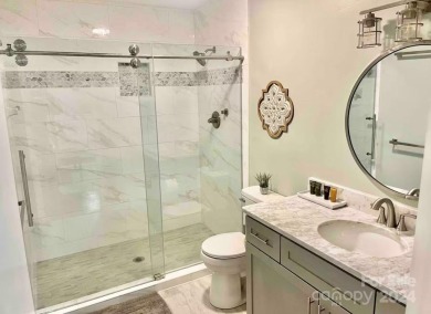 Recently renovated townhome with a bright, modern and open floor on Rumbling Bald Resort on Lake Lure in North Carolina - for sale on GolfHomes.com, golf home, golf lot