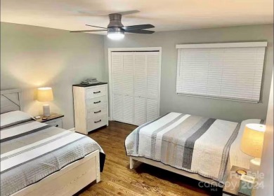 Recently renovated townhome with a bright, modern and open floor on Rumbling Bald Resort on Lake Lure in North Carolina - for sale on GolfHomes.com, golf home, golf lot