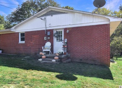 Adorable 3 bedroom home located on a large corner lot within on Mayfield-Graves Country Club in Kentucky - for sale on GolfHomes.com, golf home, golf lot