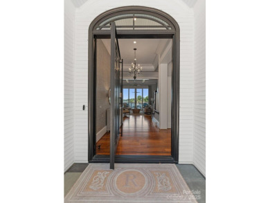 An exquisite lakefront property offering the perfect blend of on The Peninsula Club in North Carolina - for sale on GolfHomes.com, golf home, golf lot