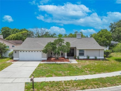Beautifully maintained 3-bedroom, 2-bath pool home in the on East Lake Woodlands Country Club in Florida - for sale on GolfHomes.com, golf home, golf lot