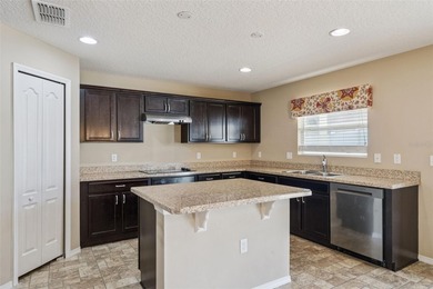 (ROOF INSPECTED, HVAC 2021, DISHWASHER 2025, WATER HEATER on Reunion Resort Golf Course in Florida - for sale on GolfHomes.com, golf home, golf lot