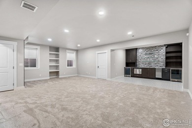 Experience maintenance-free living in Harmony Club w/ golf on Harmony Golf Club in Colorado - for sale on GolfHomes.com, golf home, golf lot