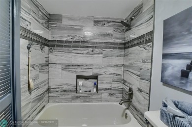 DONT MISS OUT ON THIS STUNNING RENOVATED 1900 SQ FT CORNER on Boca Dunes Golf and Country Club in Florida - for sale on GolfHomes.com, golf home, golf lot