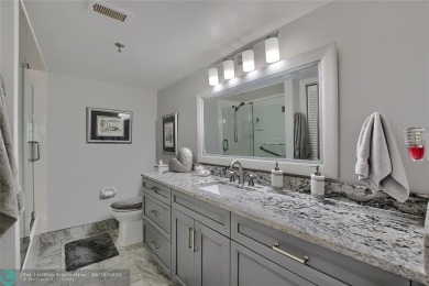 DONT MISS OUT ON THIS STUNNING RENOVATED 1900 SQ FT CORNER on Boca Dunes Golf and Country Club in Florida - for sale on GolfHomes.com, golf home, golf lot