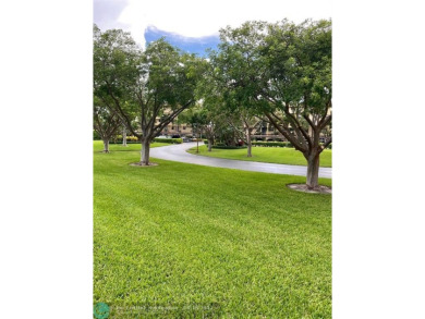 DONT MISS OUT ON THIS STUNNING RENOVATED 1900 SQ FT CORNER on Boca Dunes Golf and Country Club in Florida - for sale on GolfHomes.com, golf home, golf lot