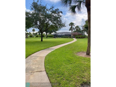 DONT MISS OUT ON THIS STUNNING RENOVATED 1900 SQ FT CORNER on Boca Dunes Golf and Country Club in Florida - for sale on GolfHomes.com, golf home, golf lot