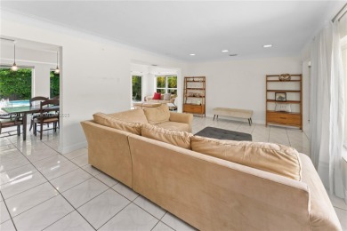Beautiful light and bright pool home in a gated residential golf on Normandy Shores Golf Course in Florida - for sale on GolfHomes.com, golf home, golf lot