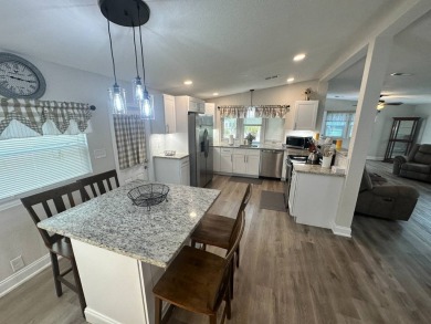 This beautifully remodeled Palm Harbor stucco home is a on Del Tura Golf and Country Club in Florida - for sale on GolfHomes.com, golf home, golf lot