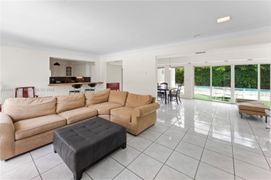 Beautiful light and bright pool home in a gated residential golf on Normandy Shores Golf Course in Florida - for sale on GolfHomes.com, golf home, golf lot