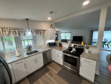 This beautifully remodeled Palm Harbor stucco home is a on Del Tura Golf and Country Club in Florida - for sale on GolfHomes.com, golf home, golf lot
