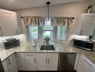 This beautifully remodeled Palm Harbor stucco home is a on Del Tura Golf and Country Club in Florida - for sale on GolfHomes.com, golf home, golf lot