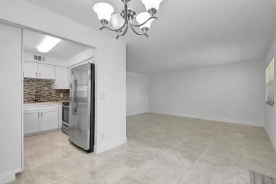 Beautifully updated first-floor unit in the sought-after Kings on Kings Point Golf - Executive in Florida - for sale on GolfHomes.com, golf home, golf lot