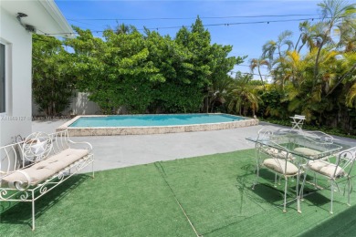 Beautiful light and bright pool home in a gated residential golf on Normandy Shores Golf Course in Florida - for sale on GolfHomes.com, golf home, golf lot