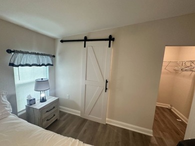 This beautifully remodeled Palm Harbor stucco home is a on Del Tura Golf and Country Club in Florida - for sale on GolfHomes.com, golf home, golf lot