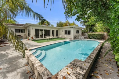 Beautiful light and bright pool home in a gated residential golf on Normandy Shores Golf Course in Florida - for sale on GolfHomes.com, golf home, golf lot