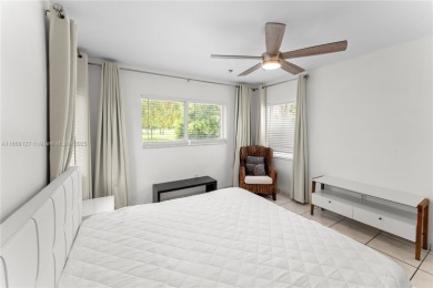 Beautiful light and bright pool home in a gated residential golf on Normandy Shores Golf Course in Florida - for sale on GolfHomes.com, golf home, golf lot