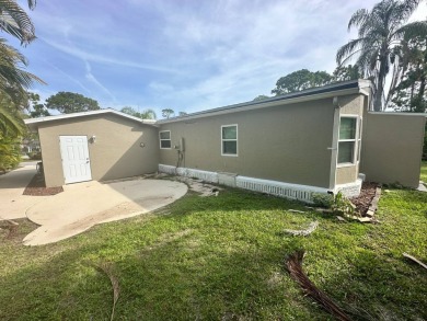 This beautifully remodeled Palm Harbor stucco home is a on Del Tura Golf and Country Club in Florida - for sale on GolfHomes.com, golf home, golf lot