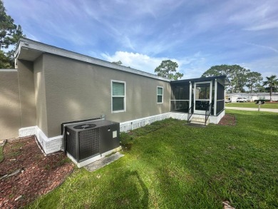 This beautifully remodeled Palm Harbor stucco home is a on Del Tura Golf and Country Club in Florida - for sale on GolfHomes.com, golf home, golf lot