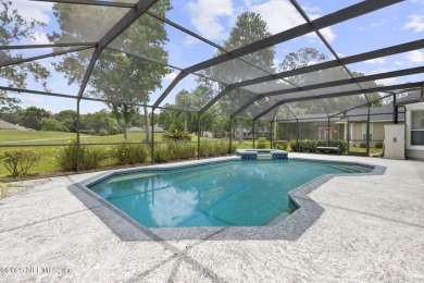 Welcome to this beautiful home located in the prestigious, gated on Country Club of Orange Park in Florida - for sale on GolfHomes.com, golf home, golf lot