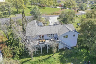 Charming 3-Bed, 2-Bath Home with Stunning Views  Lake Tulloch on The Club at Copper Valley Golf Course in California - for sale on GolfHomes.com, golf home, golf lot