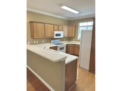 This well-maintained end-unit townhome features an open floor on  in Florida - for sale on GolfHomes.com, golf home, golf lot