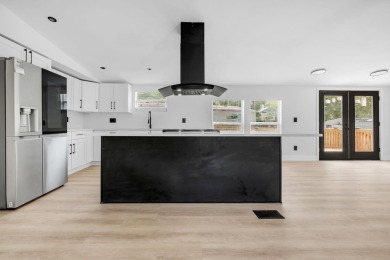 Step inside this beautifully reimagined manufactured home on Jake Gaither Golf Course in Florida - for sale on GolfHomes.com, golf home, golf lot