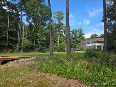 Hardwood trees and a gorgeous view! Build your dream home here on Woodlake Country Club in North Carolina - for sale on GolfHomes.com, golf home, golf lot