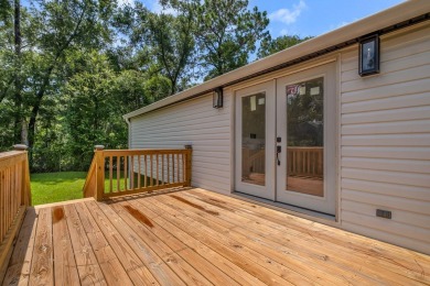 Step inside this beautifully reimagined manufactured home on Jake Gaither Golf Course in Florida - for sale on GolfHomes.com, golf home, golf lot