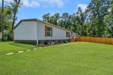 Step inside this beautifully reimagined manufactured home on Jake Gaither Golf Course in Florida - for sale on GolfHomes.com, golf home, golf lot