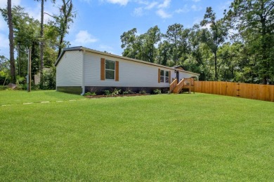 Step inside this beautifully reimagined manufactured home on Jake Gaither Golf Course in Florida - for sale on GolfHomes.com, golf home, golf lot