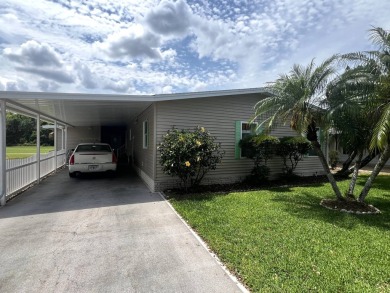 This charming 2-bedroom, 2-bathroom home offers stunning views on Lake Henry Golf Club in Florida - for sale on GolfHomes.com, golf home, golf lot
